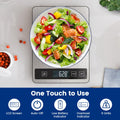 Stainless steel digital kitchen scale weighing a bowl of salad